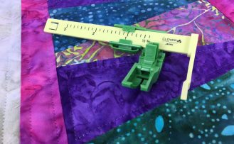 The Ultimate Quilt ‘n Stitch Presser Foot by Nancy Zieman Productions, LLC for Clover available at ShopNZP.com